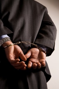 Handcuffed Man in Suit