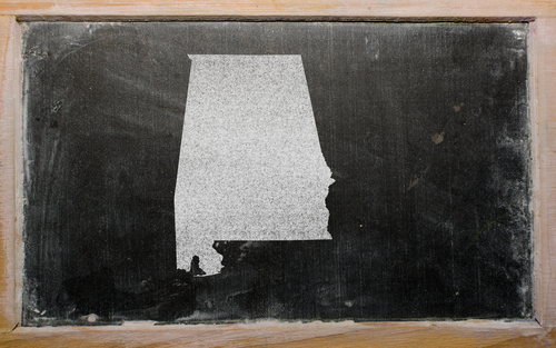 outline map of us state of alabama on blackboard