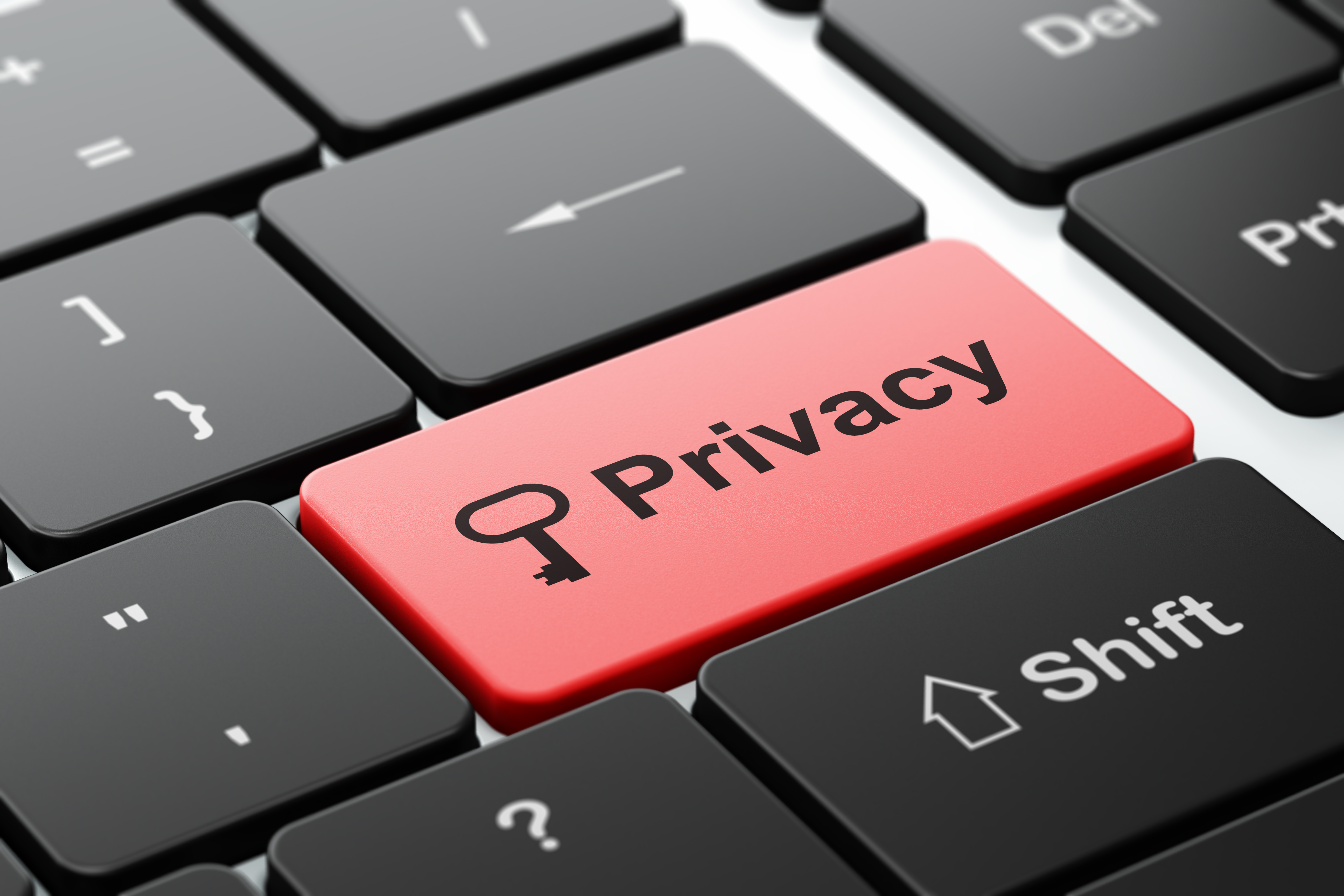 Protection concept: Key and Privacy on computer keyboard background