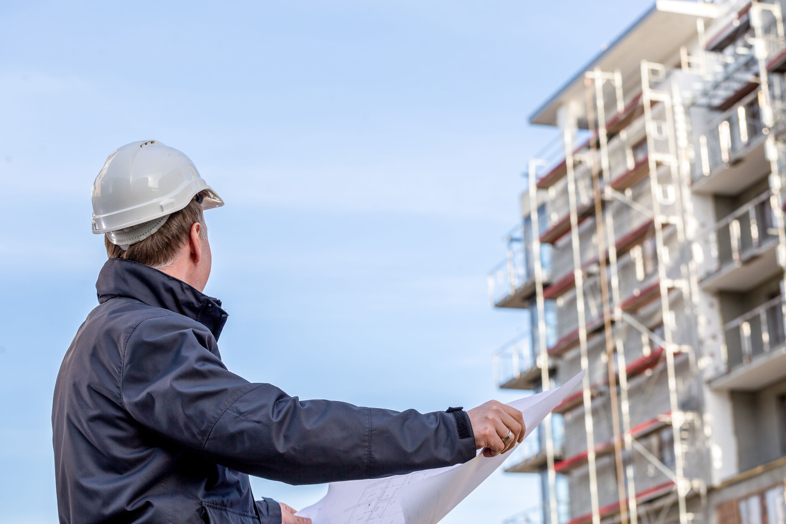 Construction manager with blueprints