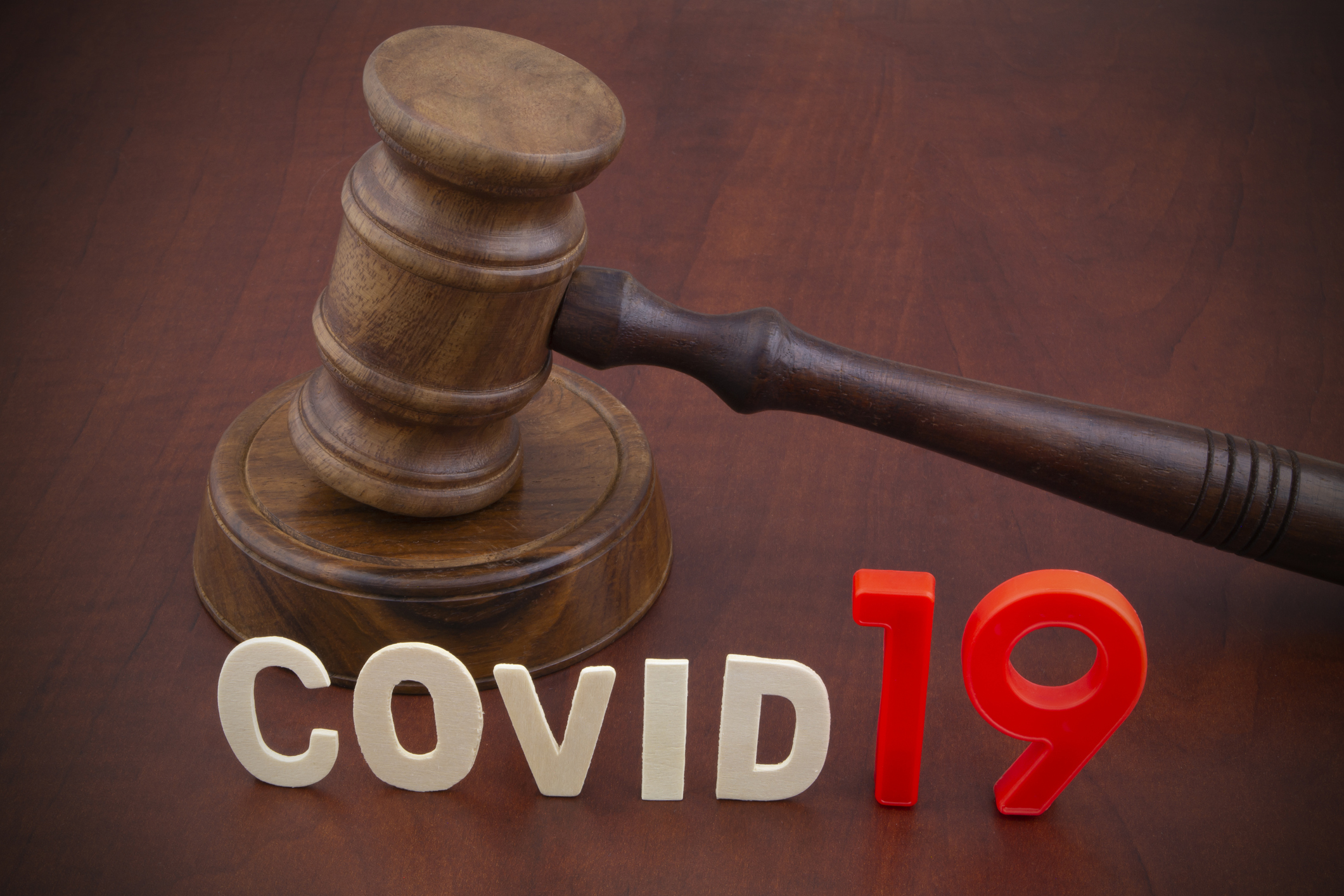 Judge's gavel with letters covid19. Concept of quarantine and law against covid-19.