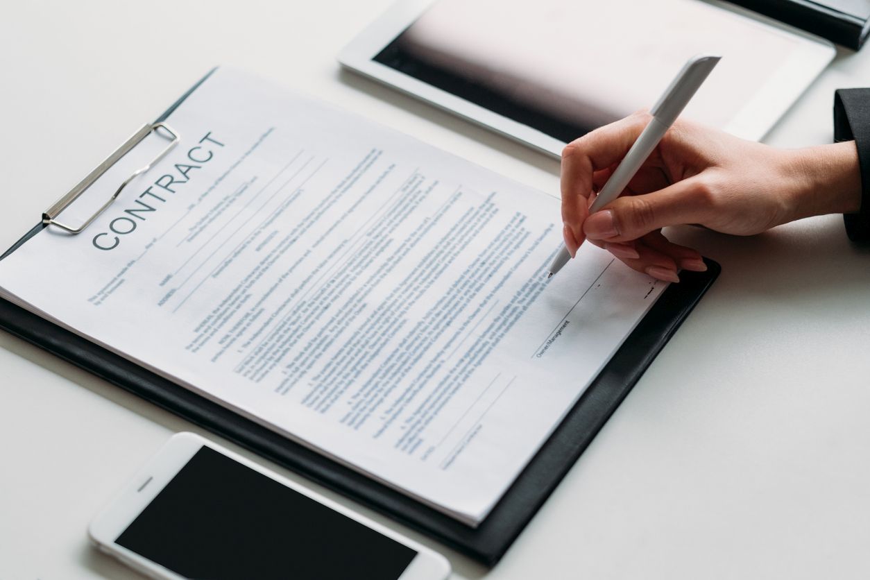 executive decision female leader signing contract