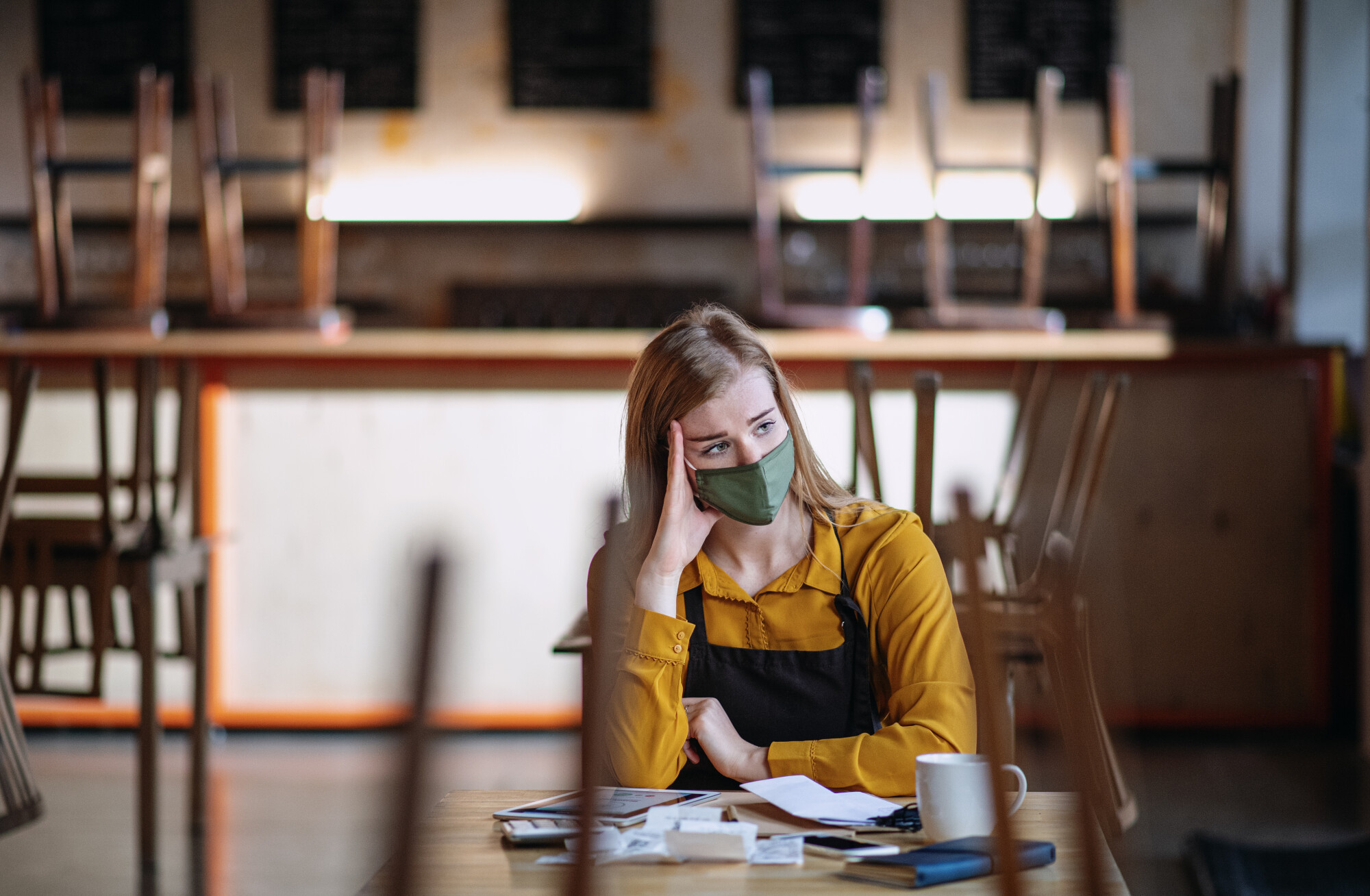 Businesswoman in Closed Caf&eacute; Due to COVID