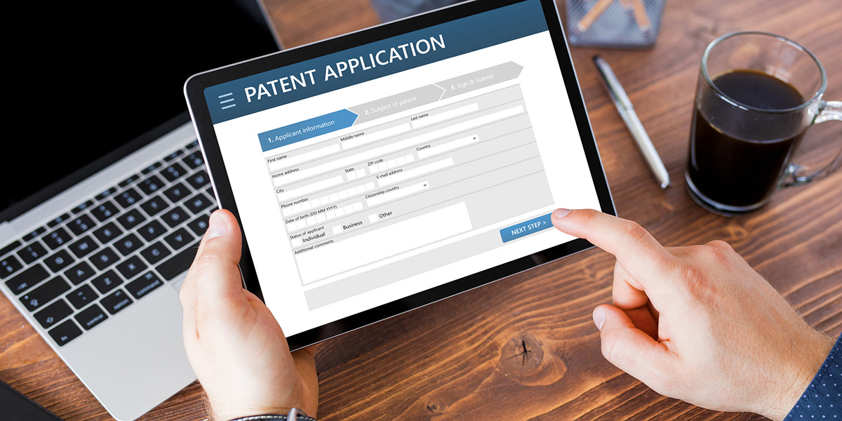 Man submitting patent application online