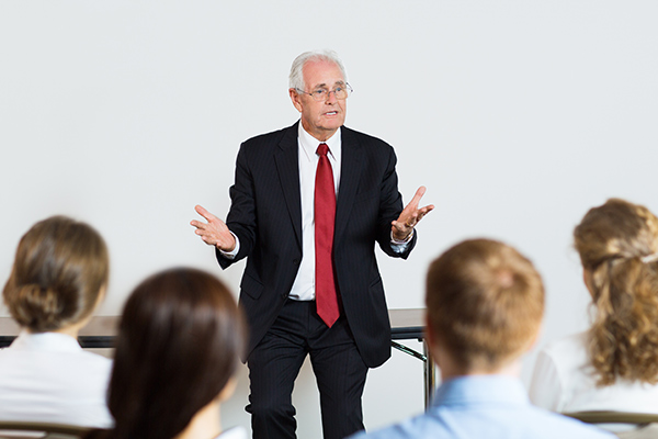 man talking to a group of people