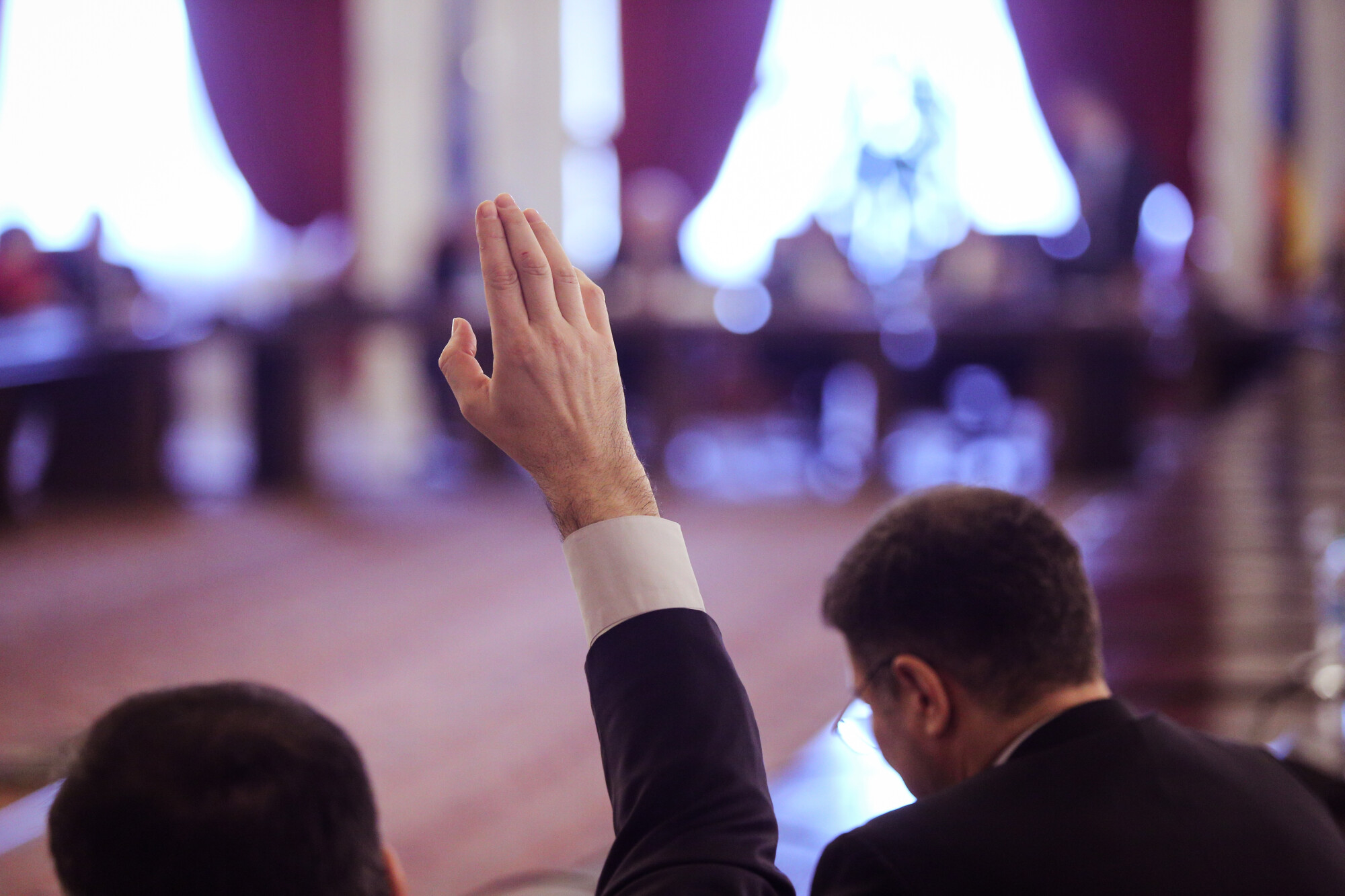 Hand Raised in Meeting