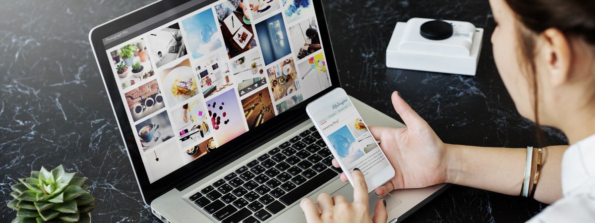 woman browing websites two screens