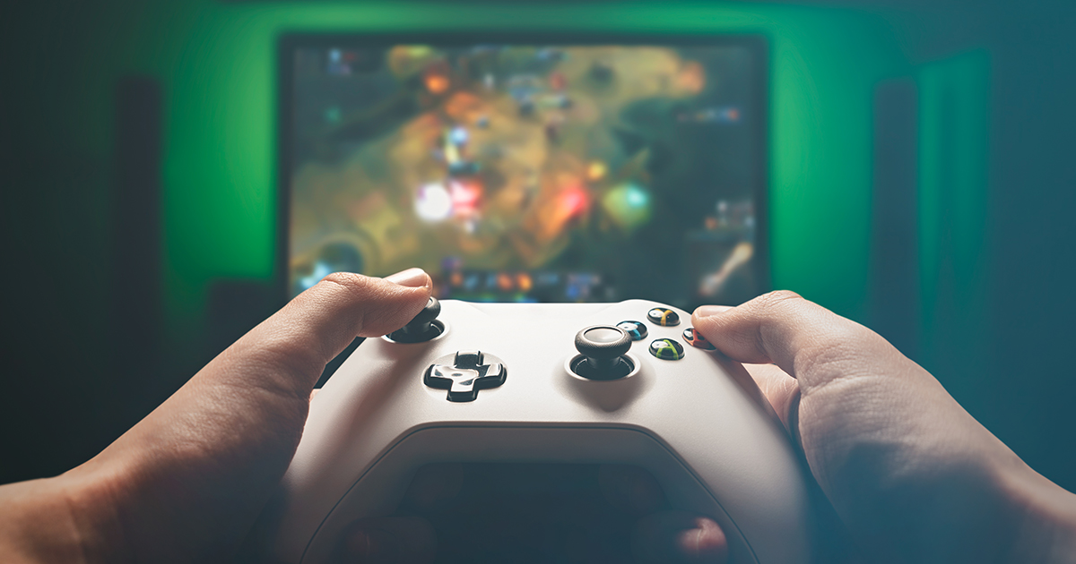 Video gaming console. Man playing RPG strategy game
