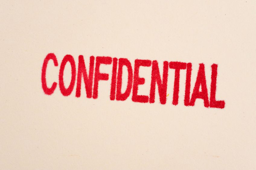 5850906 - a red condidential stamp on a manilla folder