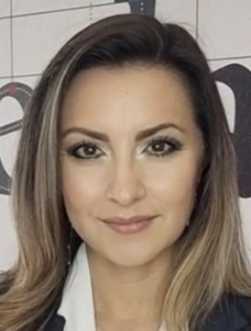 A close-up image of Arianna Becerril Garc&iacute;a, showing her in a black blazer with long hair.