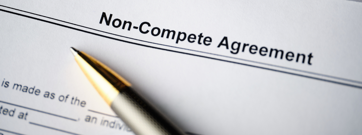 Legal document Non-Compete Agreement on paper close up.