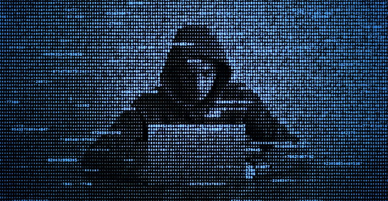 Hacker in data security concept. Hacker using laptop. Hacking the Internet. Cyber attack.