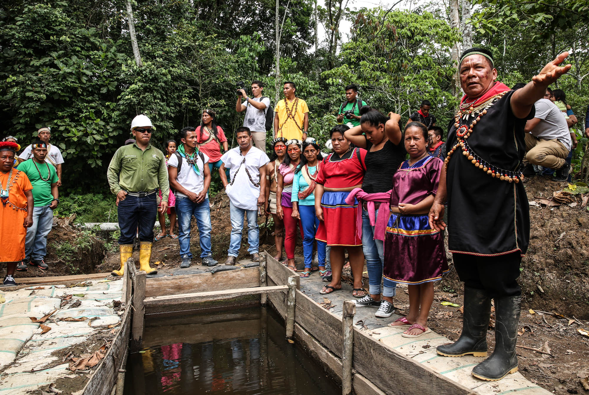 Cofán leader Emergildo Criollo (right) with members of communities from other Indigenous nations who traveled to Sucumbíos province to witness firsthand the impacts of oil industry pollution in 2018.