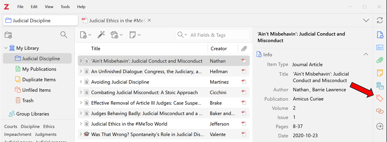 
The image shows a Zotero library interface. The left section lists several article titles and their respective creators. One item, "Judicial Ethics in the #MeToo World" by Jefferson, is highlighted. On the right pane, metadata for the highlighted item is displayed, including tags like "Law" and "Social sciences." A red arrow points to the "Tags" icon on the right-side toolbar, which is used to manage tags for the selected item.