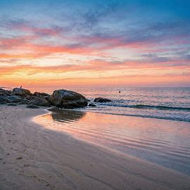 Sunset on the shore of a beach